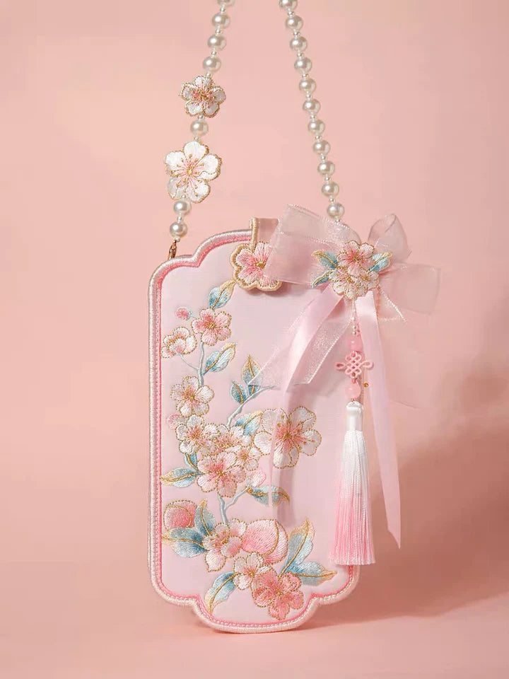 Elevate your style with the Blossom Bloom Embroidered Phone Bag. Explore our curated collection at Moon Accessories for a fashionable and functional accessory adorned with intricate cherry blossom embroidery, adding a touch of natural beauty to your ensemble.