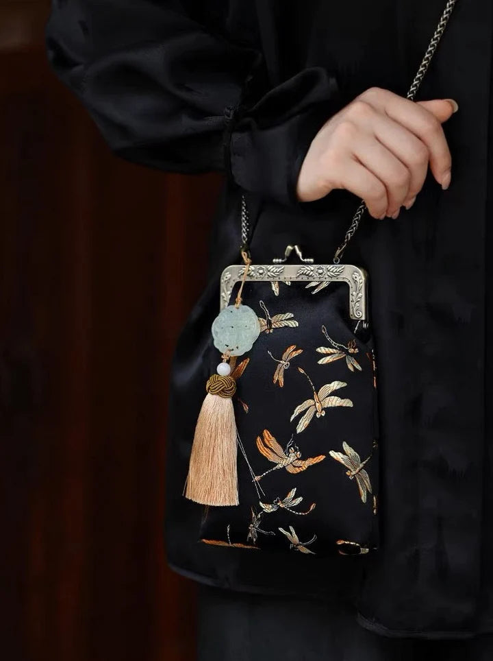 Immerse yourself in regal elegance with the Ming Dynasty Embroidered Crossbody Bag. Explore our curated collection at Moon Accessories for a timeless fusion of history and style, perfect for enhancing your ensemble with cultural sophistication.