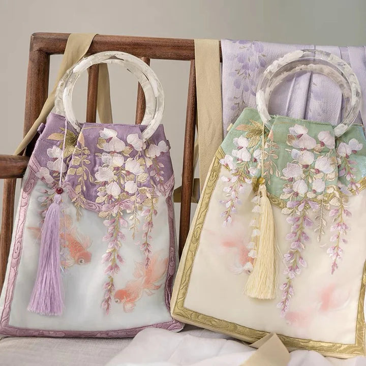 Embrace enchantment with the Enchanting Wisteria Wristlet Bag. Explore our curated collection at Moon Accessories for a stylish and functional accessory, capturing the timeless beauty of wisteria in a convenient wristlet design.