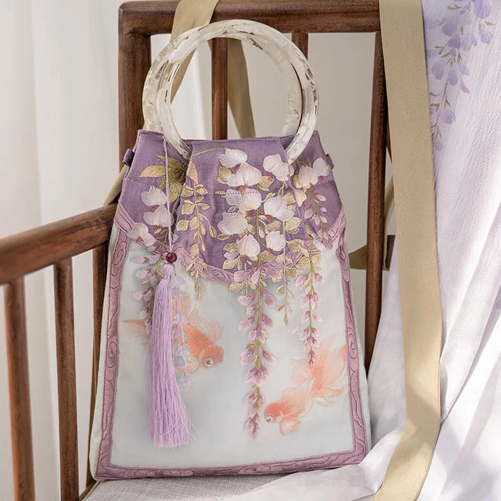 Embrace enchantment with the Enchanting Wisteria Wristlet Bag. Explore our curated collection at Moon Accessories for a stylish and functional accessory, capturing the timeless beauty of wisteria in a convenient wristlet design.