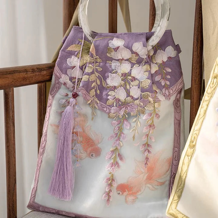 Embrace enchantment with the Enchanting Wisteria Wristlet Bag. Explore our curated collection at Moon Accessories for a stylish and functional accessory, capturing the timeless beauty of wisteria in a convenient wristlet design.