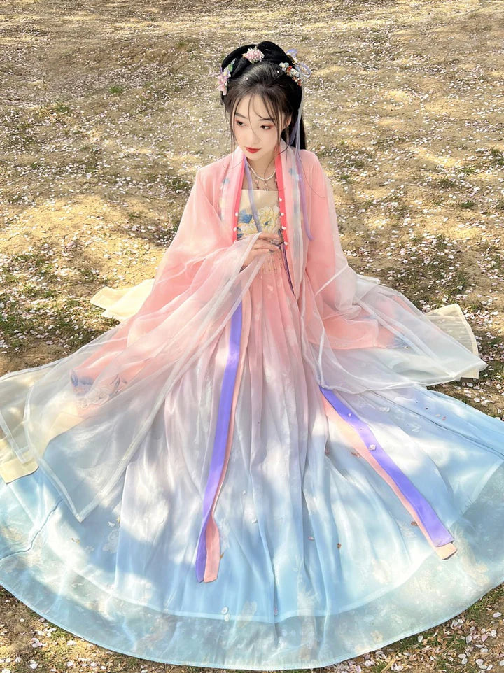 Immerse yourself in the vibrant allure of the Tang Dynasty with our Dynamic Hezi Qun, Vibrant Peach—an ensemble paying tribute to an era when style mirrored societal shifts. Influenced by Yang Guifei, this Tang Dynasty-inspired Qixiong Ruqun captures the historical trend, blending tradition with contemporary elegance. Step into the past with timeless influence, making a statement in style.