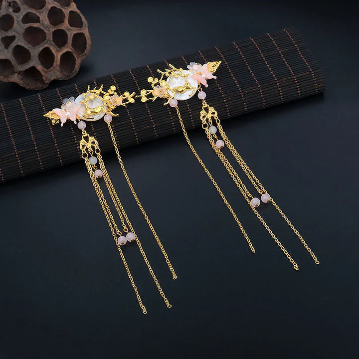 Elevate your hairstyle with the exquisite beauty of Chinese Hairpins. These traditional accessories are crafted with intricate designs and fine materials, showcasing the elegance and artistry of Chinese culture. From delicate floral patterns to ornate motifs, Chinese Hairpins add a touch of grace and sophistication to your look. Embrace the timeless allure of Chinese craftsmanship with these exquisite hairpins, perfect for complementing your Hanfu ensemble or adding a touch of cultural charm to any outfit.