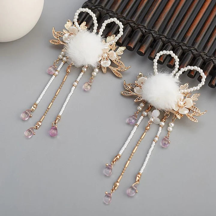 Enhance your Hanfu look with the timeless beauty of Classic Chinese Hairpins. These elegant hair accessories are inspired by traditional Chinese designs and craftsmanship, featuring intricate details and exquisite materials. From ornate floral motifs to delicate filigree work, Classic Chinese Hairpins add a touch of cultural elegance to your hairstyle. Elevate your ensemble with these iconic accessories that reflect the rich heritage and artistry of Chinese culture.