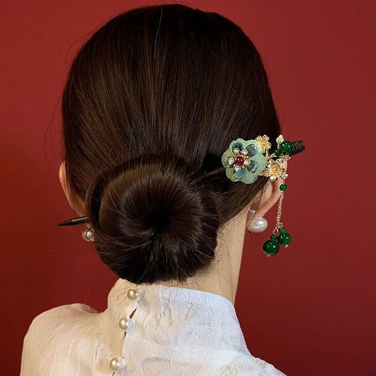 Elevate your style with this versatile Chinese Hairpin Set. Featuring a collection of beautifully crafted hairpins, this set offers a variety of traditional Chinese designs. From delicate floral patterns to intricate motifs, each hairpin is a unique accessory that adds a touch of elegance to any hairstyle. Embrace the cultural heritage of China with this captivating Chinese Hairpin Set and enhance your look with its timeless charm.