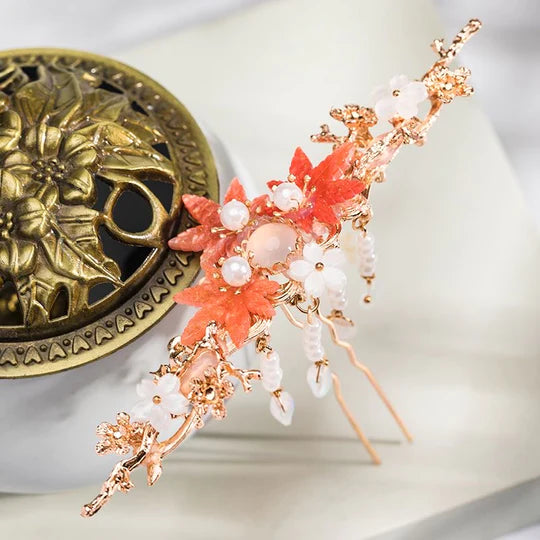 Elevate your style with the Hanfu Hairpin. This elegant accessory features a delicate design inspired by traditional Chinese fashion. With its intricate details and graceful charm, the Hanfu Hairpin adds a touch of sophistication to any hairstyle. Whether you&