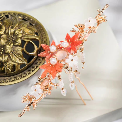 Elevate your style with the Hanfu Hairpin. This elegant accessory features a delicate design inspired by traditional Chinese fashion. With its intricate details and graceful charm, the Hanfu Hairpin adds a touch of sophistication to any hairstyle. Whether you&