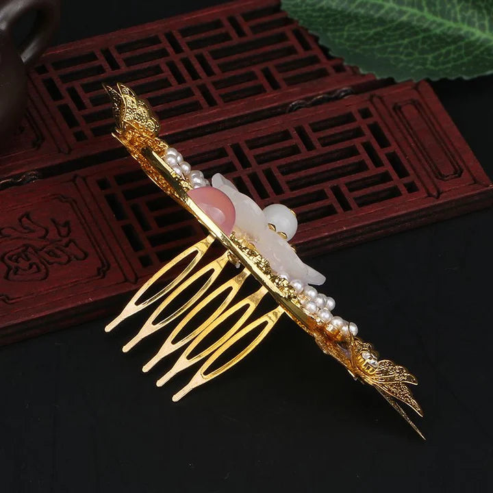 Enhance your Hanfu ensemble with the exquisite Hanfu Filigree Crown. This intricately designed crown features delicate filigree work, adding a regal touch to your hairstyle. Crafted with meticulous attention to detail, the Hanfu Filigree Crown is the perfect accessory to elevate your Hanfu look and make a statement with its timeless elegance.