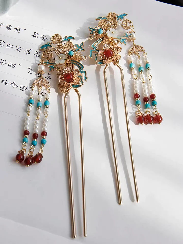 Achieve an elegant and traditional hairstyle with the exquisite Hanfu Hairstick. This versatile accessory is designed to secure and adorn your hair in a graceful manner, adding a touch of sophistication to your Hanfu ensemble. Crafted with attention to detail, the Hanfu Hairstick showcases intricate patterns and a sleek design, reflecting the timeless beauty of traditional Chinese culture. Embrace the charm of the Hanfu Hairstick and elevate your hairstyle with its refined elegance.