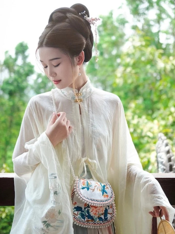 Immerse yourself in regal elegance with the Ming Dynasty Embroidered Crossbody Bag. Explore our curated collection at Moon Accessories for a timeless fusion of history and style, perfect for enhancing your ensemble with cultural sophistication.