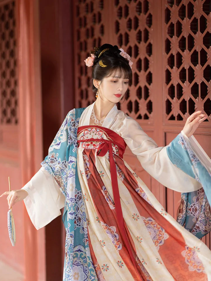 Immerse yourself in the allure of the Tang Dynasty with our Timeless Qixiong Ruqun Ensemble, paying tribute to an era when style reflected societal shifts. Influenced by Yang Guifei, this ensemble captures the preference for plumper figures, encapsulating a unique chapter in feminine ideals. The regal &quot;Da Xiu Shan&quot; coat, adorned with Flourishing Paisley, merges tradition with contemporary elegance. Step out in style, embracing timeless influence with a nod to centuries past.