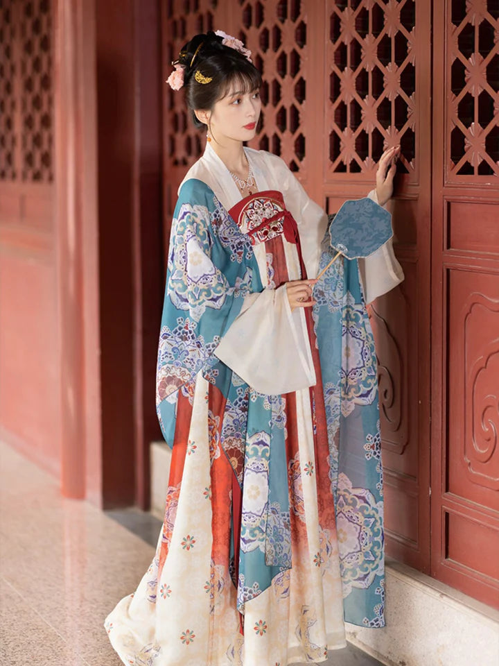 Immerse yourself in the allure of the Tang Dynasty with our Timeless Qixiong Ruqun Ensemble, paying tribute to an era when style reflected societal shifts. Influenced by Yang Guifei, this ensemble captures the preference for plumper figures, encapsulating a unique chapter in feminine ideals. The regal "Da Xiu Shan" coat, adorned with Flourishing Paisley, merges tradition with contemporary elegance. Step out in style, embracing timeless influence with a nod to centuries past.