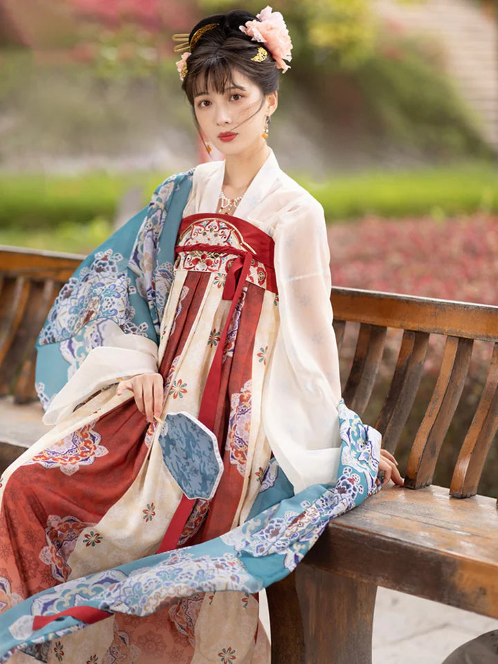 Immerse yourself in the allure of the Tang Dynasty with our Timeless Qixiong Ruqun Ensemble, paying tribute to an era when style reflected societal shifts. Influenced by Yang Guifei, this ensemble captures the preference for plumper figures, encapsulating a unique chapter in feminine ideals. The regal &quot;Da Xiu Shan&quot; coat, adorned with Flourishing Paisley, merges tradition with contemporary elegance. Step out in style, embracing timeless influence with a nod to centuries past.