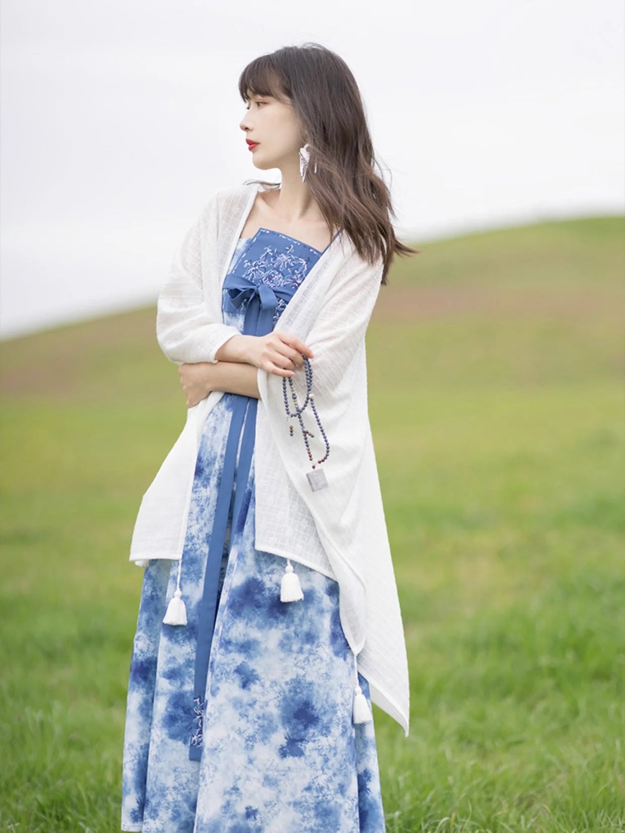 Step into a world of refined beauty with Modern Hanfu Elegance—a seamless fusion of traditional grace and contemporary style. Embrace the allure of ancient Chinese fashion, elevating your wardrobe with timeless elegance and cultural sophistication. Rediscover the past while embracing the sophistication of the present in this captivating ensemble.