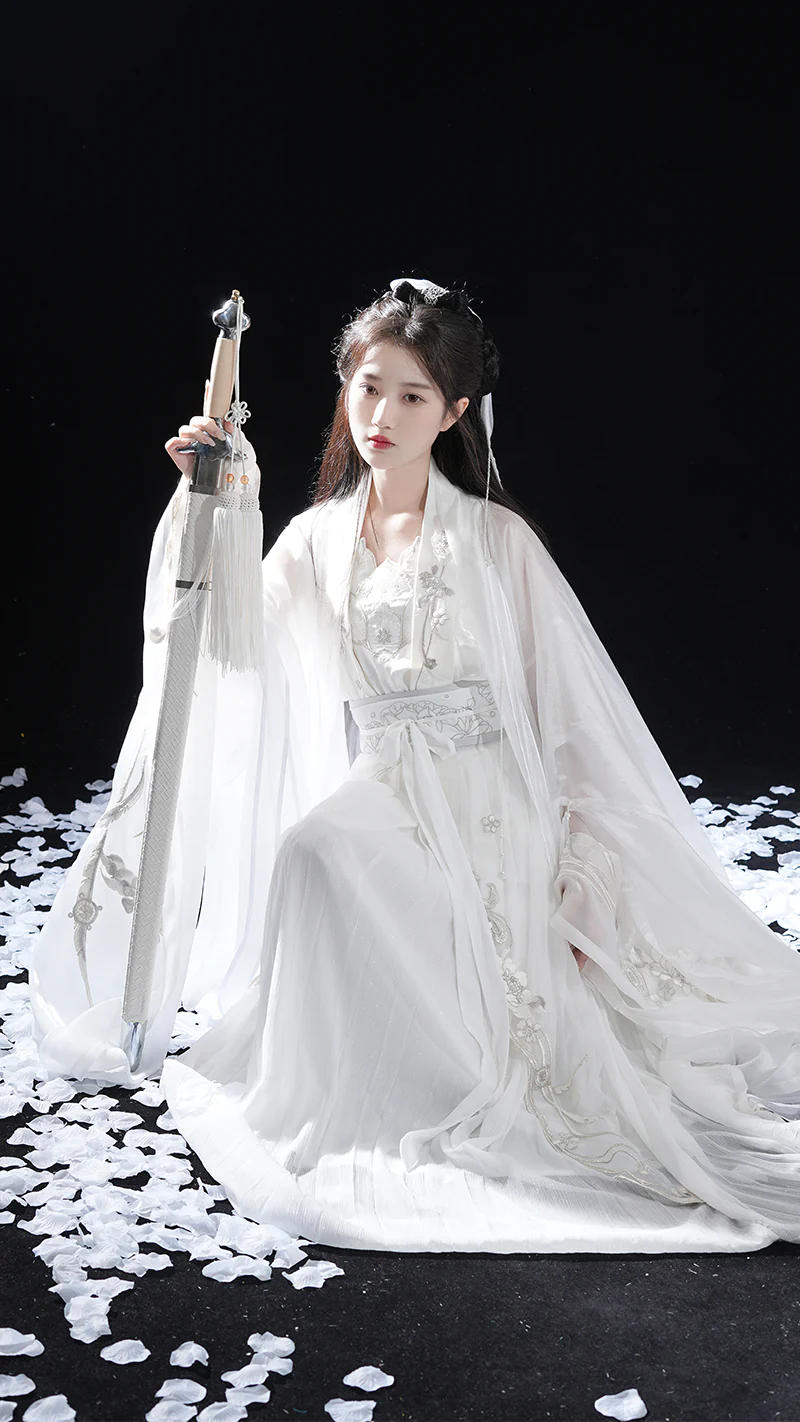 Immerse yourself in the allure of the Tang Dynasty with our Inviting Qiyao Ruqun, Cozy Camryn—an ensemble that pays homage to a bygone era when style reflected societal shifts. Influenced by Yang Guifei, this Tang Dynasty-inspired Qixiong Ruqun captures historical trends, merging tradition with contemporary elegance. Step out in style, embracing the timeless influence of centuries past.