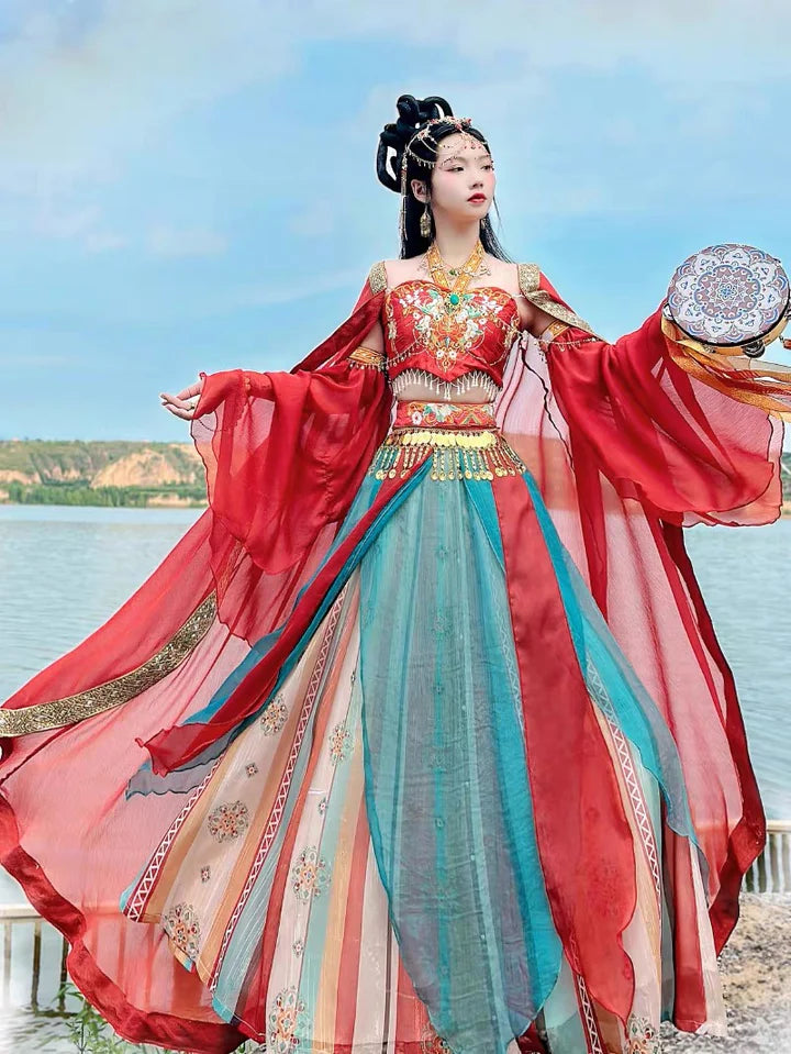 Embark on a journey of ethereal radiance with Elizabeth Dunhuang Hanfu, an exquisite fusion of Central Asian, Tibetan, Indian, and Chinese influences exclusively curated by Moon Hanfu. Originating from the northwest Chinese region along the Silk Road, this traditional attire from our Dunhuang Collection reflects the diverse cultural interactions of the area. Embrace a vibrant palette that illuminates the region&