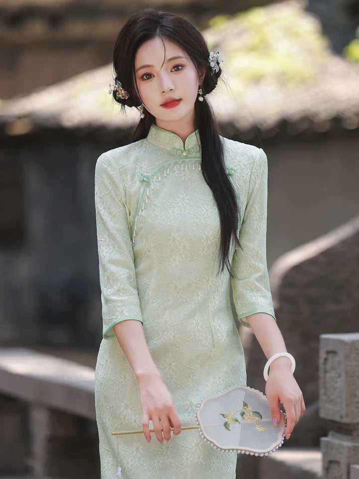 Immerse yourself in timeless elegance with the Qipao, also known as cheongsam—a Chinese dress that embodies tradition, femininity, and style. Originating in the 1920s, its iconic figure-hugging silhouette, high collar, and long sleeves have become emblematic.