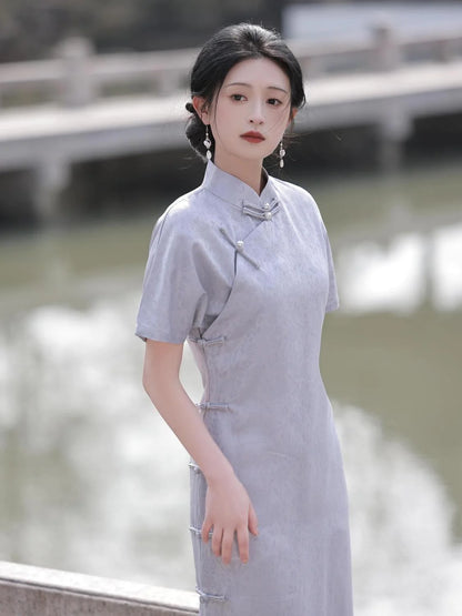 Embrace timeless elegance with the Elegant Short Sleeve Qipao in Grey—a blend of tradition, femininity, and style from Moon Hanfu&