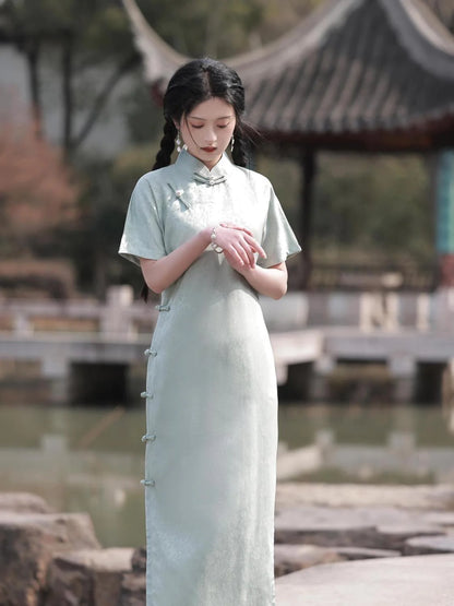 Embrace timeless elegance with the Elegant Short Sleeve Qipao in Grey—a blend of tradition, femininity, and style from Moon Hanfu&