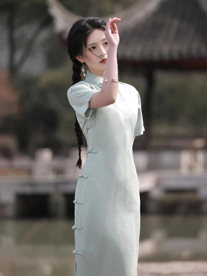 Embrace timeless elegance with the Elegant Short Sleeve Qipao in Grey—a blend of tradition, femininity, and style from Moon Hanfu&