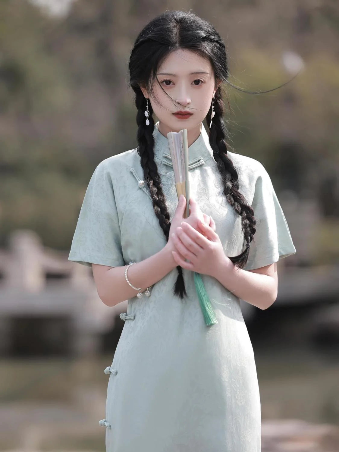 Embrace timeless elegance with the Elegant Short Sleeve Qipao in Grey—a blend of tradition, femininity, and style from Moon Hanfu&