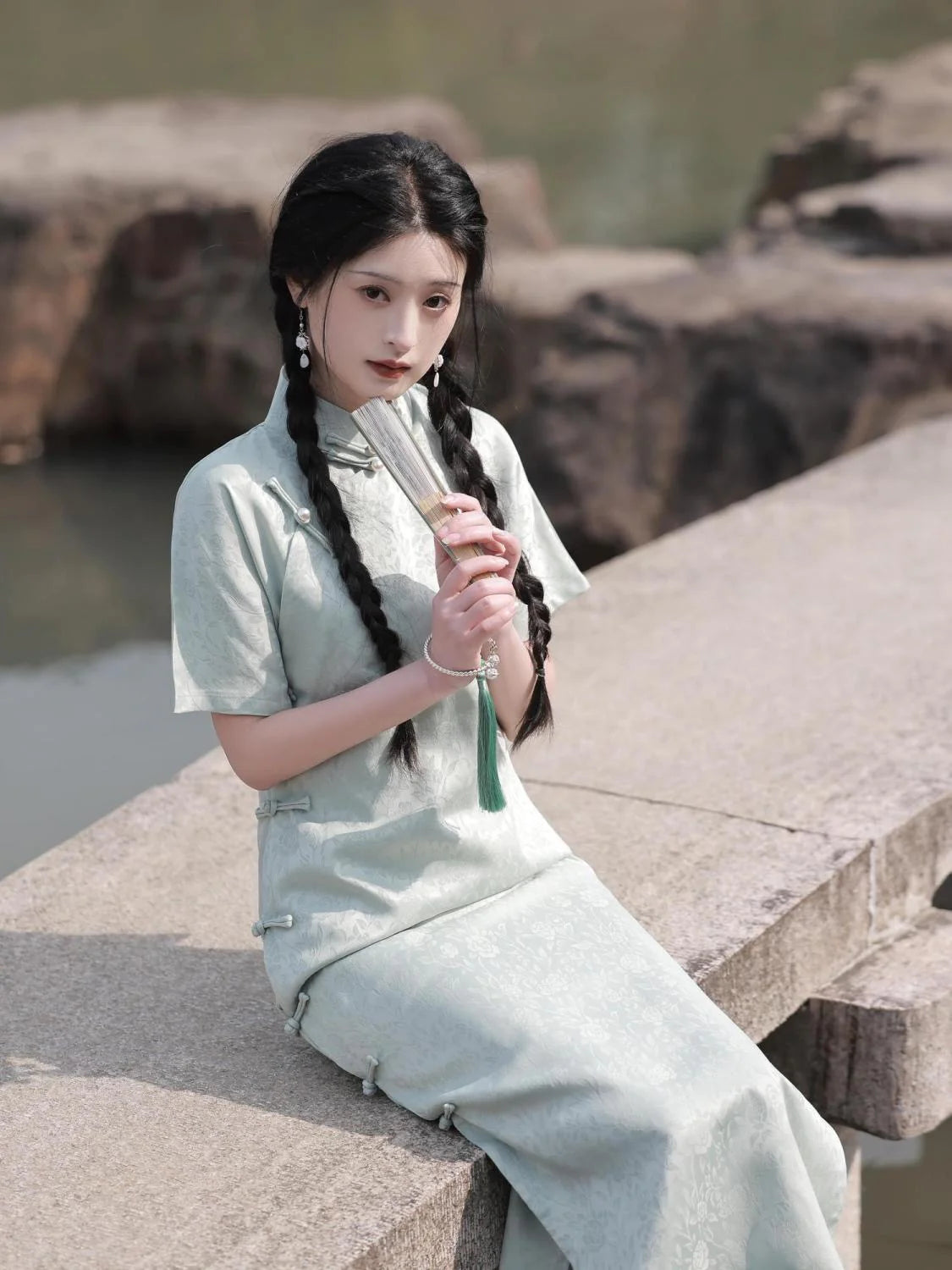 Embrace timeless elegance with the Elegant Short Sleeve Qipao in Grey—a blend of tradition, femininity, and style from Moon Hanfu&