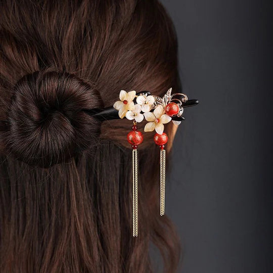 Spring Chinese Hairpins - Celebrate the beauty of spring with these enchanting hairpins. Delicate designs inspired by blooming flowers add freshness and elegance. Perfect for garden parties, cultural events, or embracing the spirit of renewal.