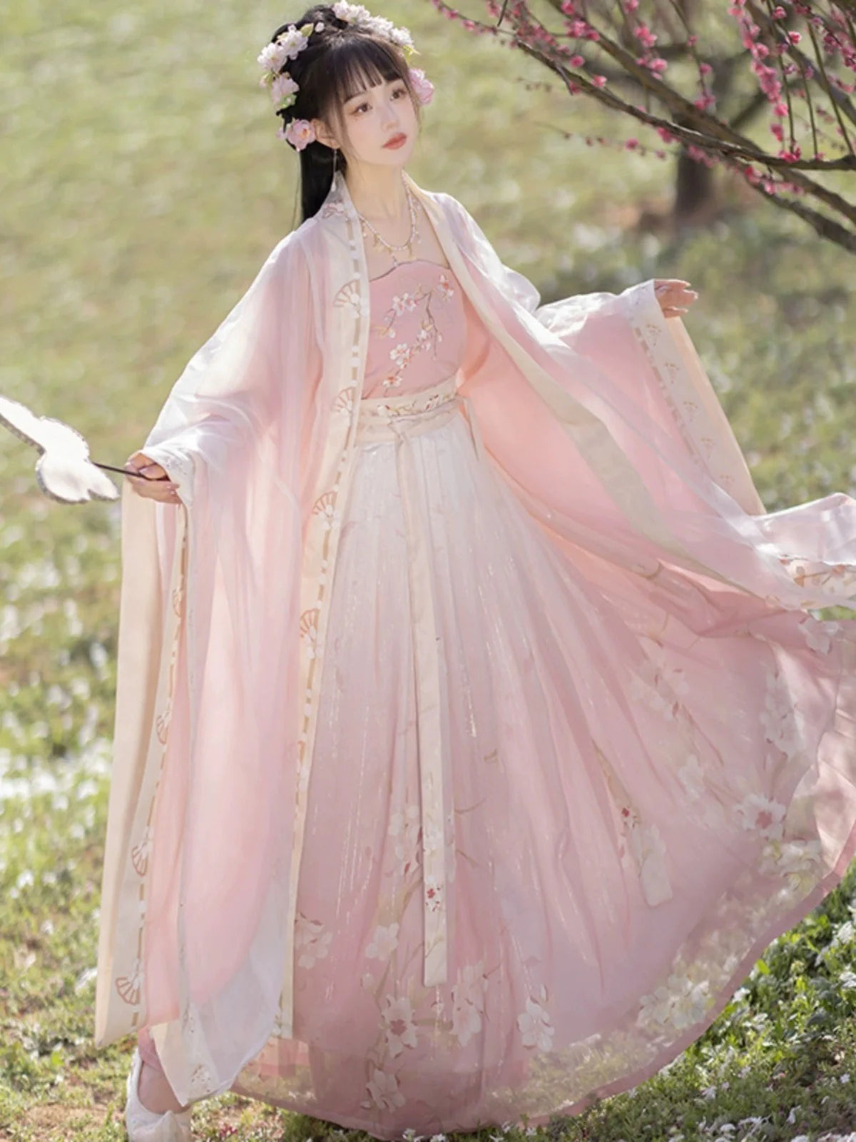 Blossom in radiant style with our Radiant Qiyao Ruqun, Rosy Blossom—an enchanting ensemble that embodies the timeless beauty and grace of a blooming flower. Elevate your look with a blend of tradition and contemporary elegance, making a statement inspired by the allure of nature.