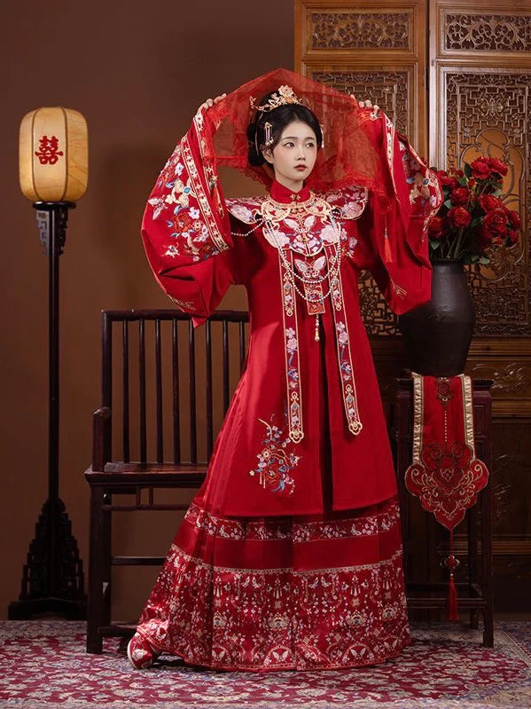 Explore the allure of Ming dynasty-inspired fashion with the exquisite Li Ling Shan, Queenie collection. Immerse yourself in the timeless elegance of traditional Chinese clothing, blending ancient charm seamlessly with contemporary allure.