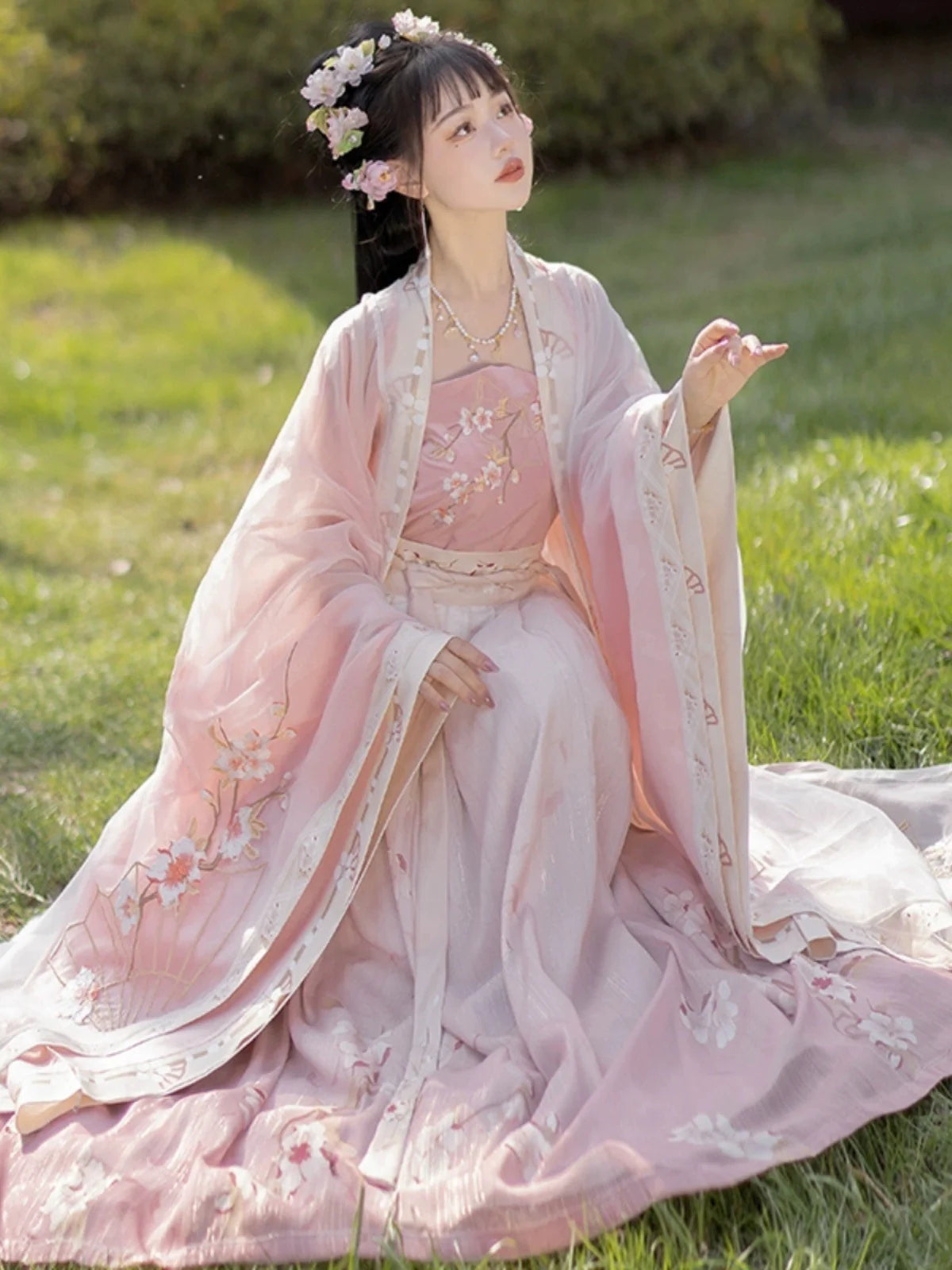 Blossom in radiant style with our Radiant Qiyao Ruqun, Rosy Blossom—an enchanting ensemble that embodies the timeless beauty and grace of a blooming flower. Elevate your look with a blend of tradition and contemporary elegance, making a statement inspired by the allure of nature.