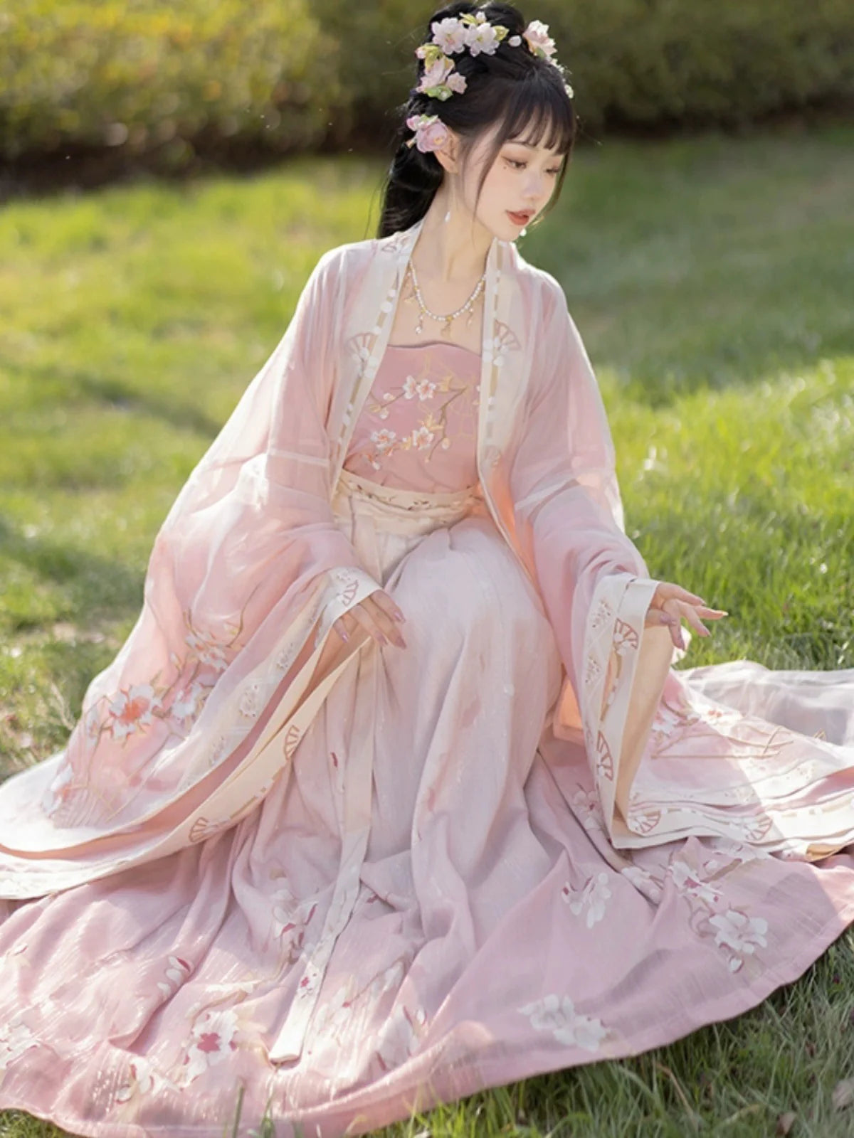 Blossom in radiant style with our Radiant Qiyao Ruqun, Rosy Blossom—an enchanting ensemble that embodies the timeless beauty and grace of a blooming flower. Elevate your look with a blend of tradition and contemporary elegance, making a statement inspired by the allure of nature.