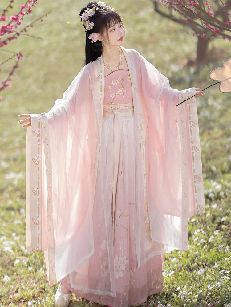 Blossom in radiant style with our Radiant Qiyao Ruqun, Rosy Blossom—an enchanting ensemble that embodies the timeless beauty and grace of a blooming flower. Elevate your look with a blend of tradition and contemporary elegance, making a statement inspired by the allure of nature.