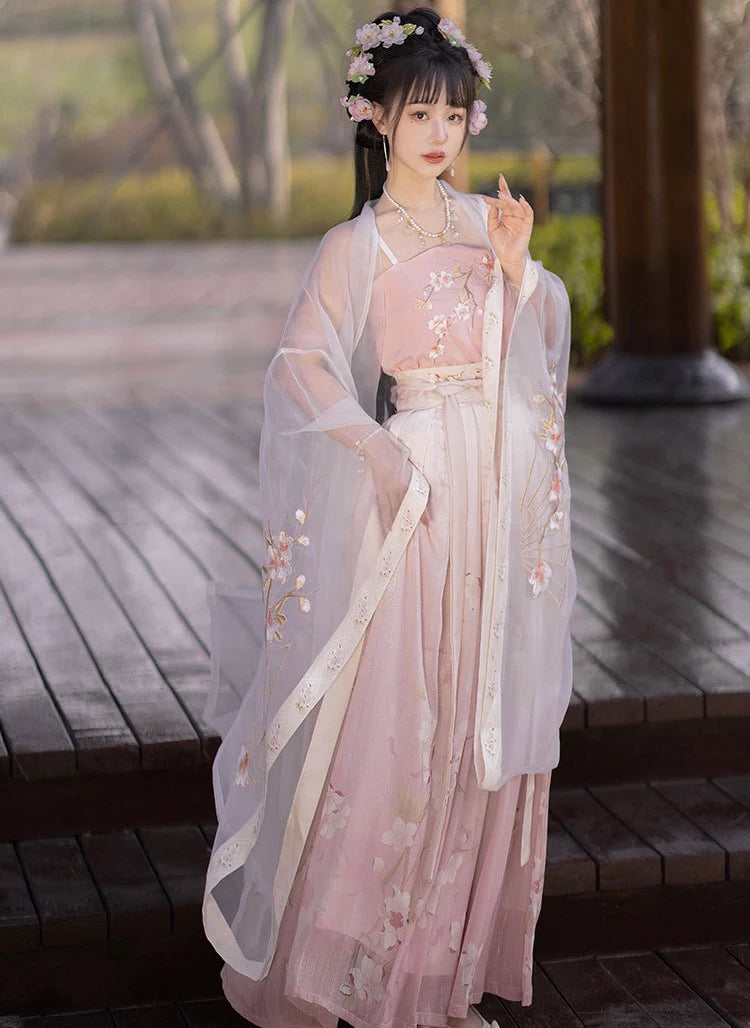 Blossom in radiant style with our Radiant Qiyao Ruqun, Rosy Blossom—an enchanting ensemble that embodies the timeless beauty and grace of a blooming flower. Elevate your look with a blend of tradition and contemporary elegance, making a statement inspired by the allure of nature.