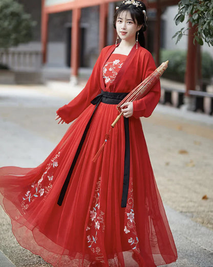 Experience timeless Tang Dynasty-inspired elegance with our Qixiong Ruqun, paying homage to the historical influence of Yang Guifei. This two or three-piece ensemble, complemented by a regal &quot;Da Xiu Shan&quot; coat, seamlessly blends tradition with contemporary style for a sophisticated and graceful look. Step into the allure of the Tang Dynasty with our elegant Salonga attire.