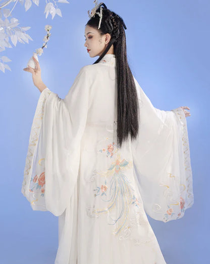 Whisper into elegance with Whisper Jiaoling Ruqun, an enchanting homage to the grace of the Wei Jin Dynasty. Immerse yourself in the distinctive style of cross-collared and wide-sleeved garments, inspired by the iconic Jin Ru 晋襦 and Za Ju 杂裾 fashion trends. Elevate your connection to Chinese tradition through Moon Hanfu&