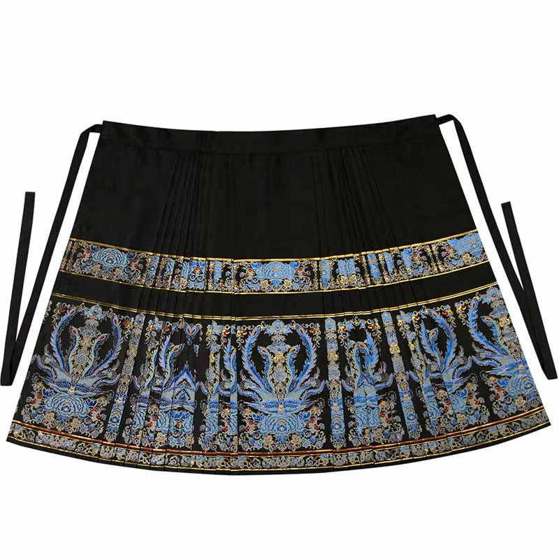 Flat view of the black tie-waist mamian skirt with blue phoenix motifs, gold borders and pleated sides