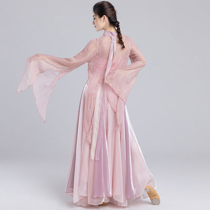 Full back view of a pink dance outfit with a long split-back sheer top and layered skirt