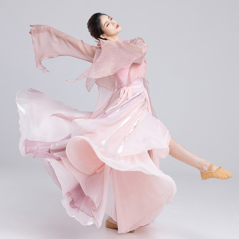 Pink classical dance outfit in motion showing the flared skirt and long flowing sleeves