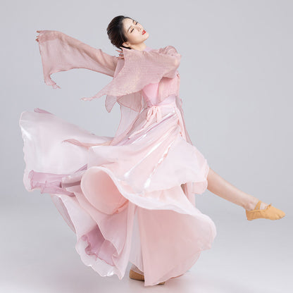 Pink classical dance outfit in motion showing the flared skirt and long flowing sleeves