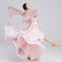 Pink classical dance outfit in motion showing the flared skirt and long flowing sleeves