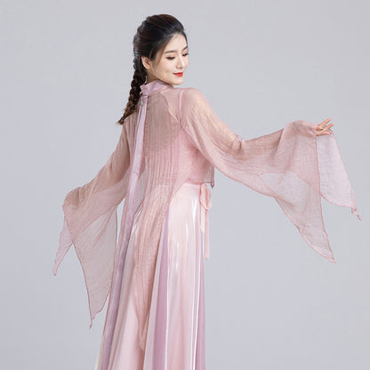 Back detail of the pink sheer dance top with flared sleeves, a split hem and trailing ties