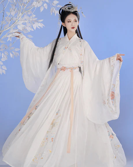 Whisper into elegance with Whisper Jiaoling Ruqun, an enchanting homage to the grace of the Wei Jin Dynasty. Immerse yourself in the distinctive style of cross-collared and wide-sleeved garments, inspired by the iconic Jin Ru 晋襦 and Za Ju 杂裾 fashion trends. Elevate your connection to Chinese tradition through Moon Hanfu&