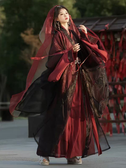 Full-length view of Yu Ji Tan hanfu in burgundy and black, showing wide sleeves and flowing layers.