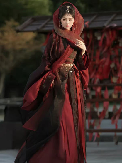 Styled view of Yu Ji Tan burgundy and black hanfu showing the cross collar, sleeve details and draped fabric.